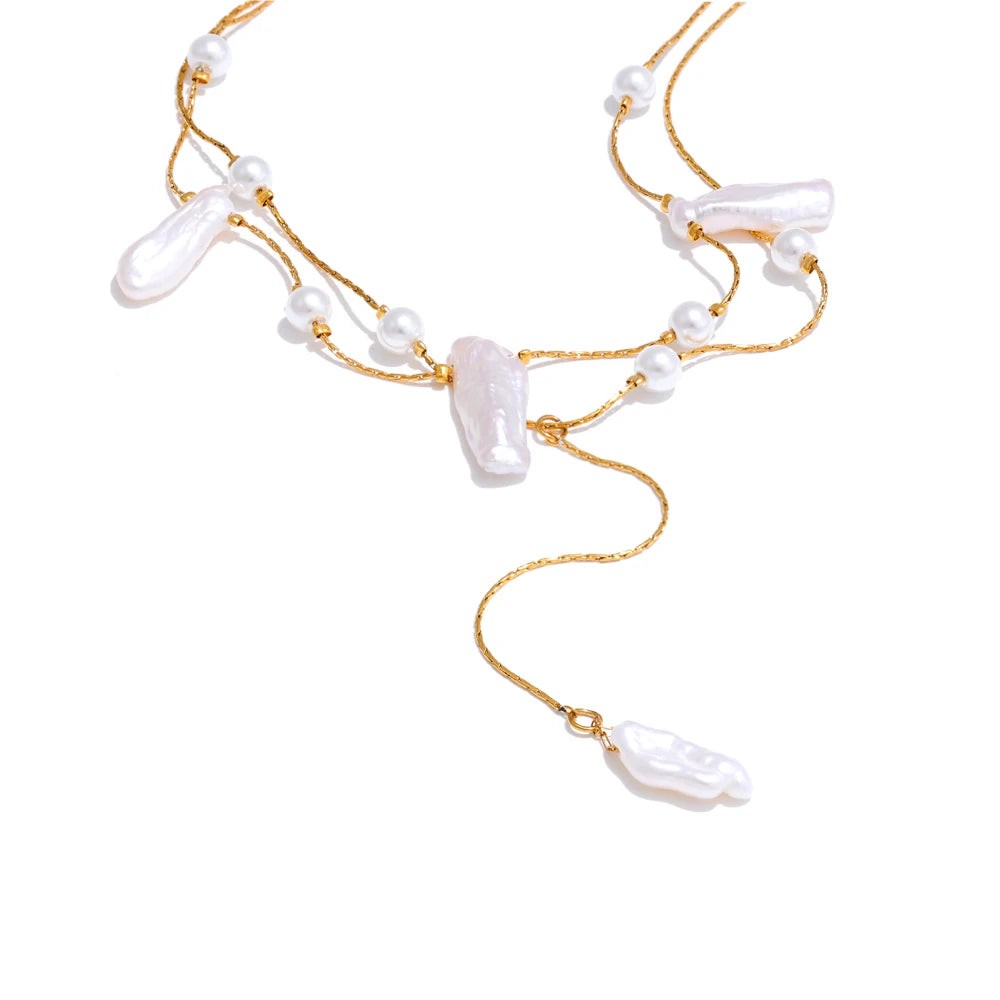 Double-layer gold chain necklace with baroque pearls, round pearls and a Y-drop on white