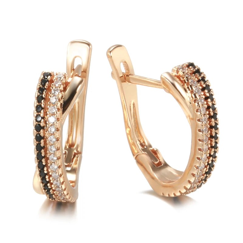 Pair of rose gold hoop earrings with black and clear pavé stones, front and side view