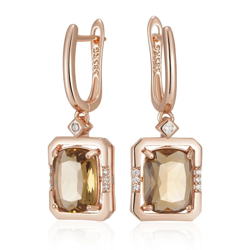 Pair of rose gold square drop earrings with champagne cubic zirconia, front view on white