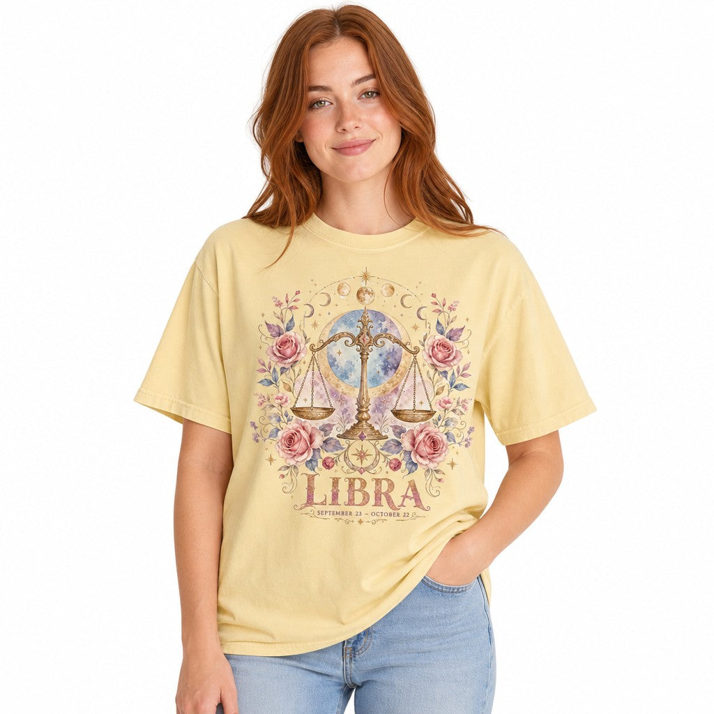 Woman in butter yellow Comfort Colors 1717 t-shirt showcasing a boho watercolor mystical Libra scales design with pink roses, crescent moons, golden stars, and cosmic elements, ideal for free-spirited astrology lovers, by Crossroads Dandelion