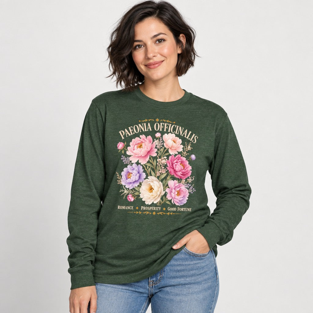 Woman wearing heather forest green Bella Canvas 3501 long sleeve featuring a romantic watercolor peony and wildflower design with vintage botanical script, elegant cottagecore floral for garden and botanical lovers, by Crossroads Dandelion