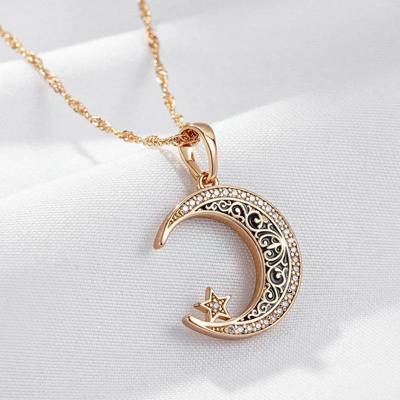 Close-up of the black enamel filigree and sparkling edge of the crescent moon pendant