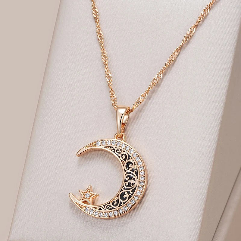Crescent moon and star necklace on a cream satin jewelry display