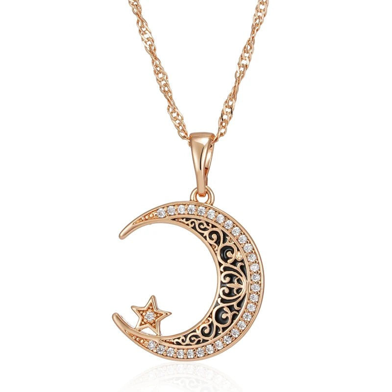 Rose gold crescent moon and star pendant with black enamel filigree on a twisted chain, front view