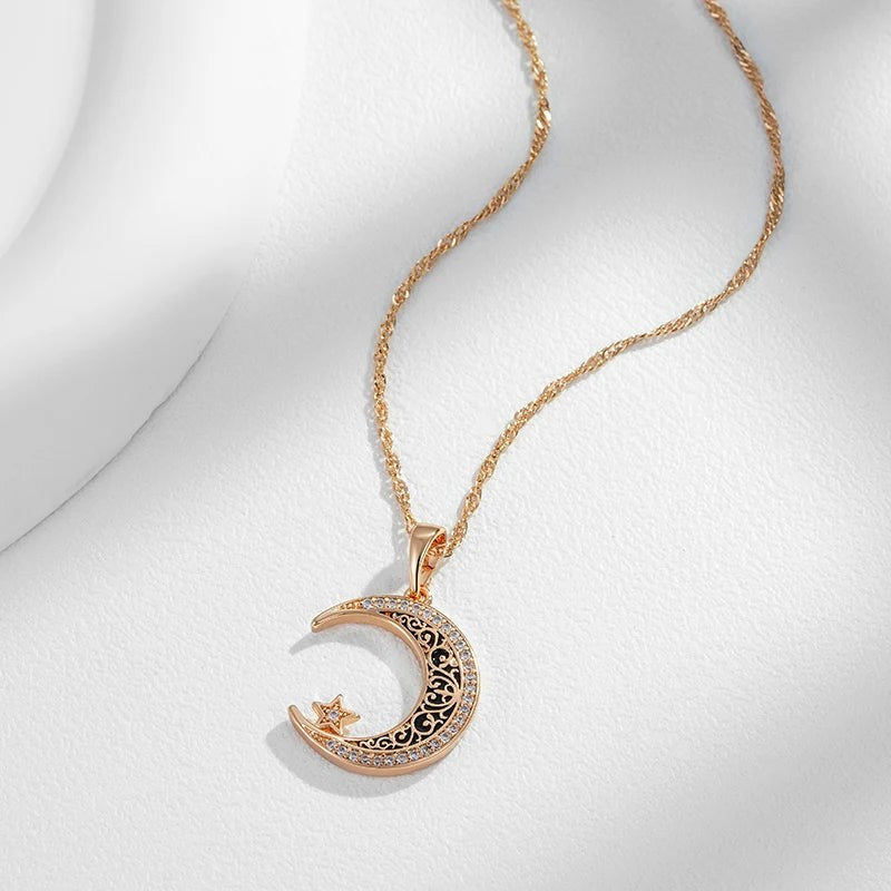 Crescent moon and star necklace with its fine twisted chain on white fabric