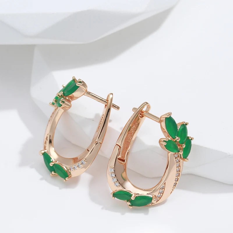 Side view of rose gold green leaf hoop earrings showing the hinged clasp