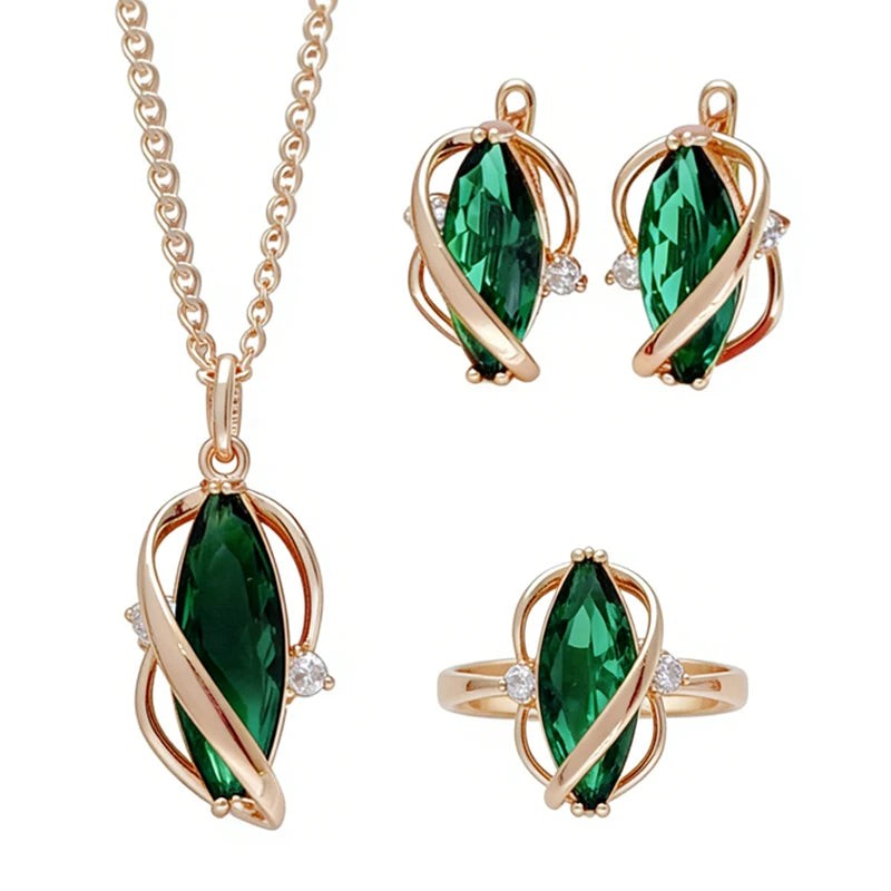 Green leaf jewelry set with pendant necklace, earrings and ring in rose gold, front view on white
