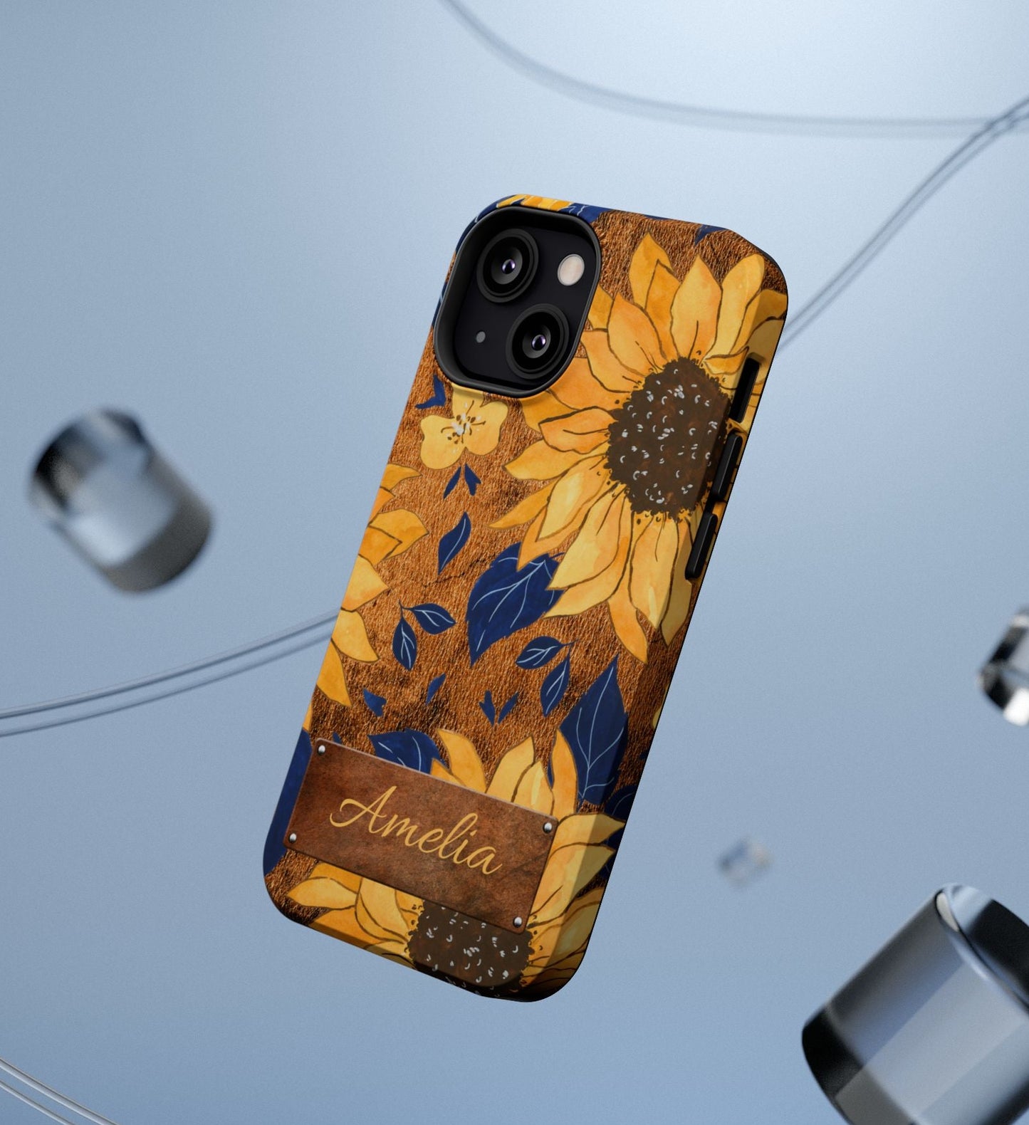 Custom name personalized sunflower western tough phone case for iPhone 13 Mini, featuring bold yellow sunflowers, navy blue leaves, rustic brown faux leather texture background, and a riveted metal name plate — perfect boho cowgirl gift, by Crossroads Dandelion