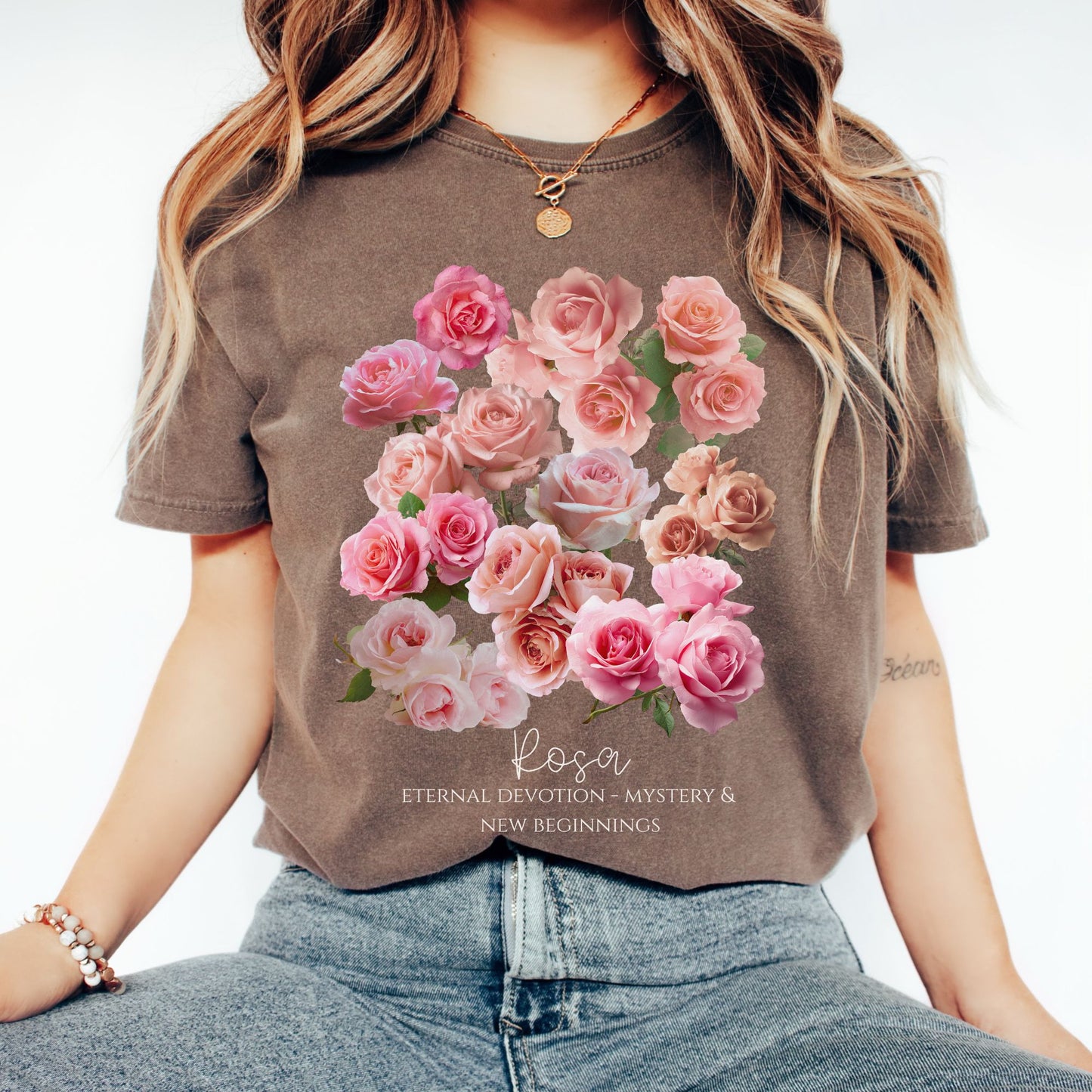 
Woman wearing an Espresso Comfort Colors garment-dyed Rosa June birth flower tee with symbolic meaning text– Crossroads Dandelion