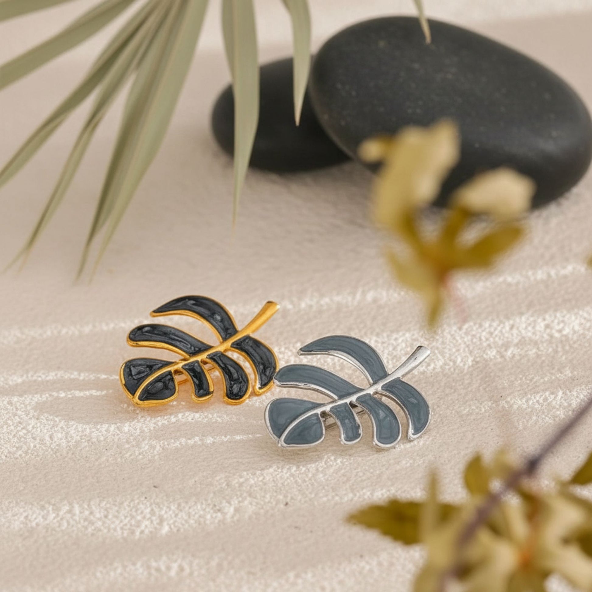 Leaf brooch product lifestyle display on neutral background, by Crossroads Dandelion