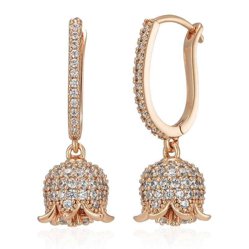 Pair of rose gold lily of the valley bell flower earrings paved with clear zirconia, front view