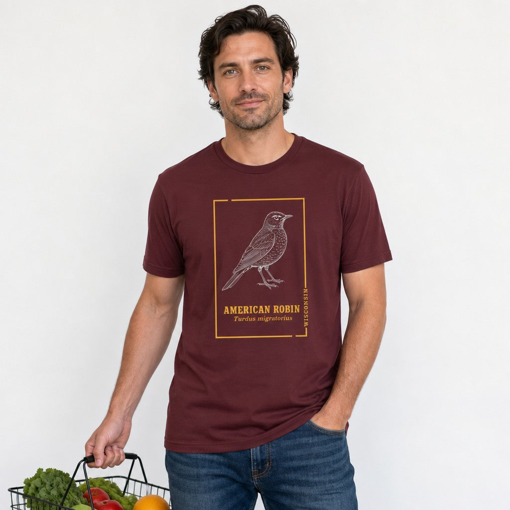 Man wearing a maroon Bella Canvas 3001 t-shirt with a detailed line art American Robin illustration and vintage botanical accents, nature-inspired fashion for birdwatchers and cottagecore enthusiasts, by Crossroads Dandelion