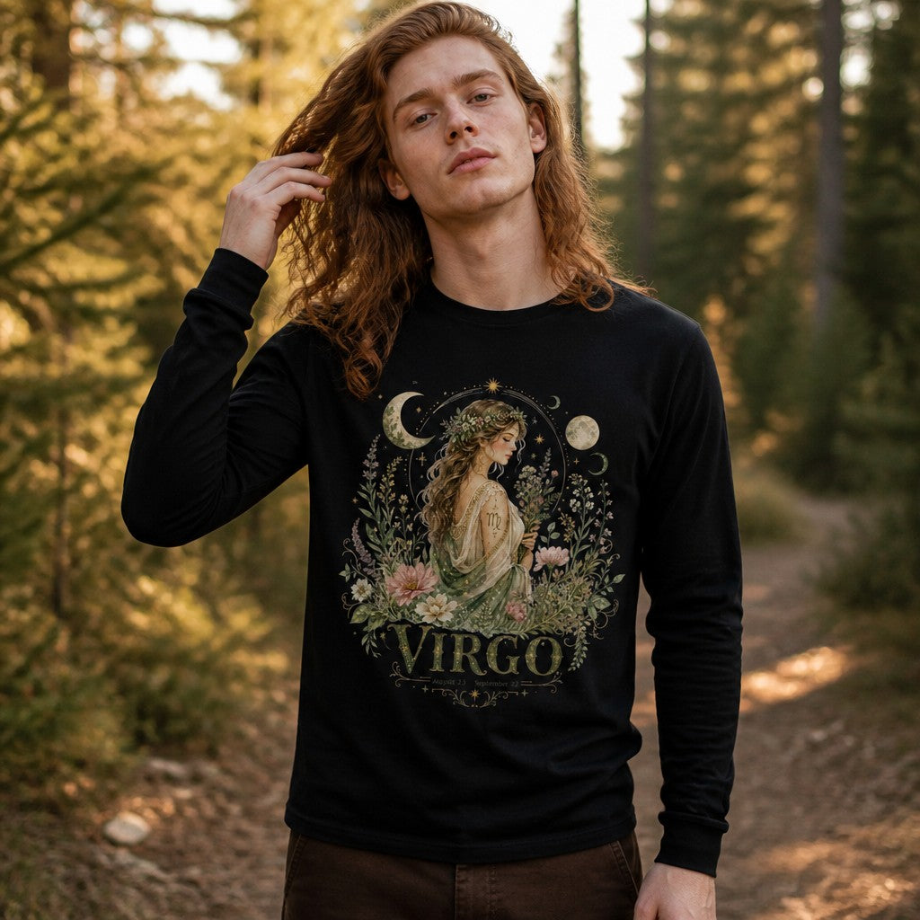 Man wearing black Bella Canvas 3501 long sleeve shirt with vintage watercolor cottagecore Virgo maiden surrounded by wildflowers, crescent moons, and celestial stars, standing on a forest trail, astrology and nature lovers, by Crossroads Dandelion