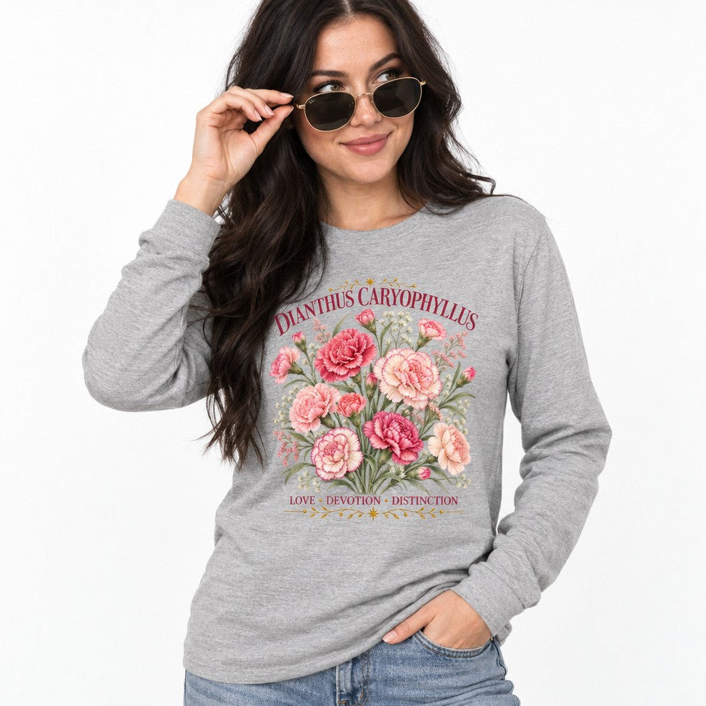 Woman in athletic heather Bella Canvas 3501 long sleeve shirt featuring a vintage botanical illustration of pink and cream Dianthus Caryophyllus carnations with ornate gold embellishments and romantic text, classic floral lovers apparel, by Crossroads Dandelion