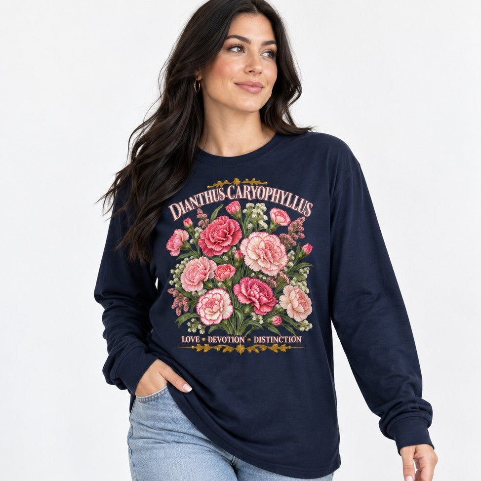 Woman wearing navy Bella Canvas 3501 long sleeve shirt featuring vintage cottagecore watercolor carnations with botanical text, ideal for garden lovers and feminine floral fashion, by Crossroads Dandelion