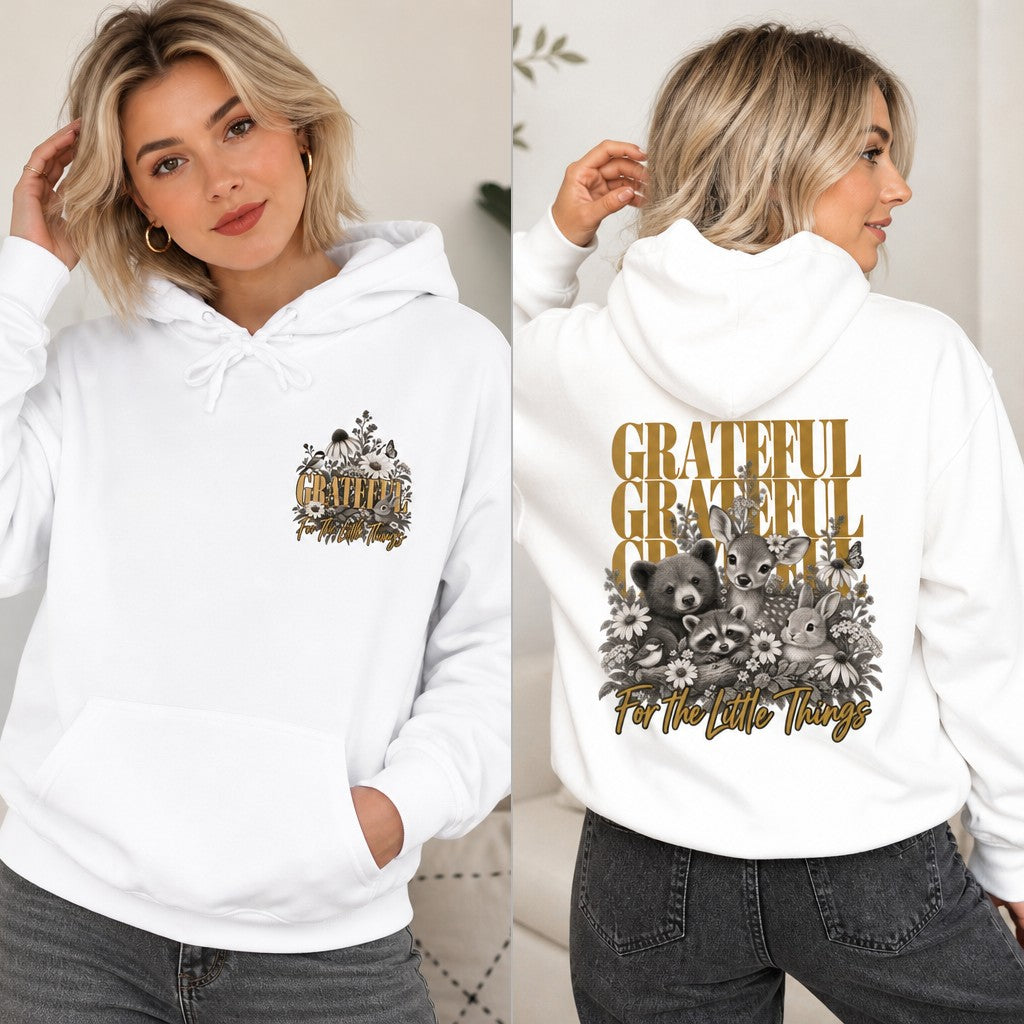 Woman in a white hoodie featuring a retro-inspired 'Grateful Grateful Grateful' typography with adorable woodland animals and sunflowers, cozy casual wear for women who love positive affirmations and cute animal art, by Crossroads Dandelion