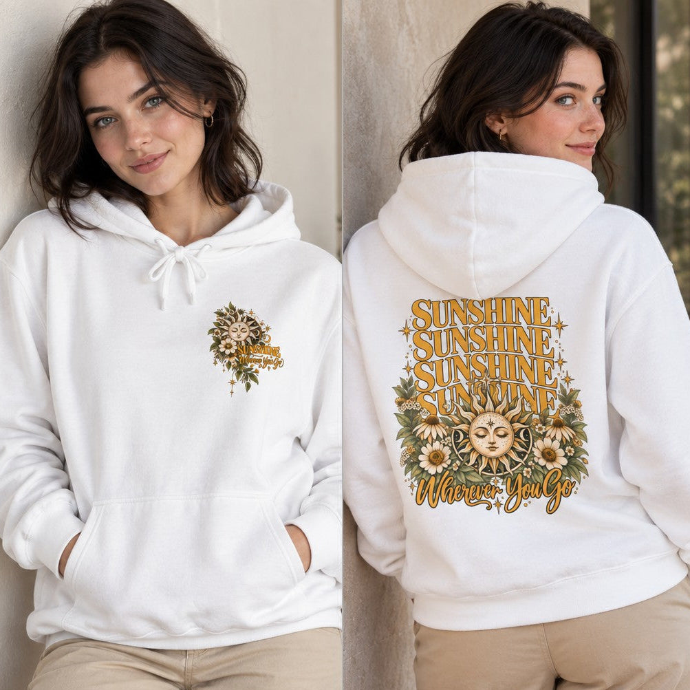 Woman wearing a white hoodie with a retro vintage sun and sunflower graphic, featuring repeated 'sunshine' text and 'wherever you go' on the back, cozy casual style, ideal for outdoor lovers, by Crossroads Dandelion