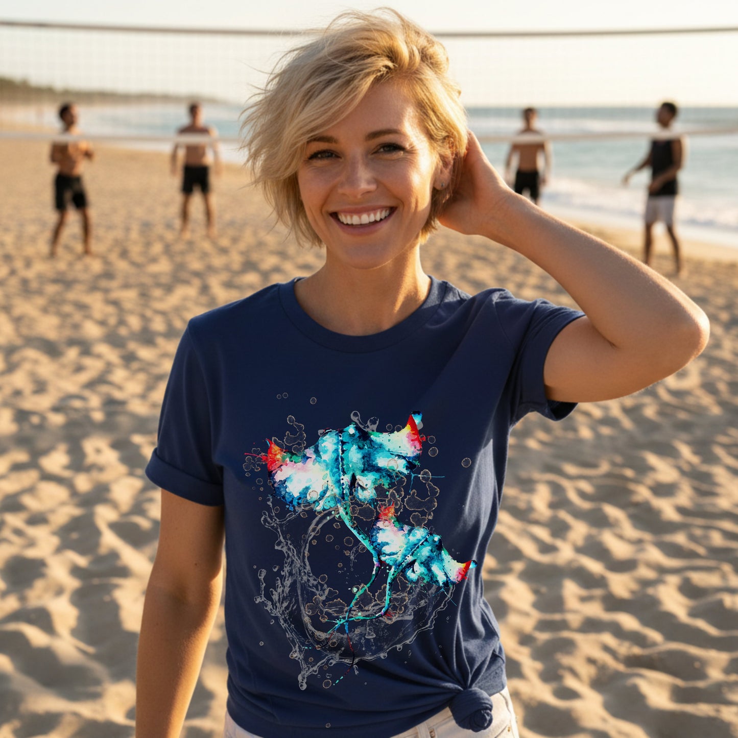 Woman wearing a navy blue t-shirt with a colorful stingray design on a beach