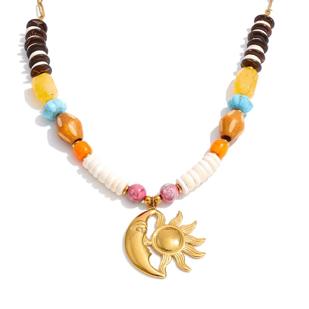Sun and moon beaded necklace with coconut shell, wood and stone beads, front view on white