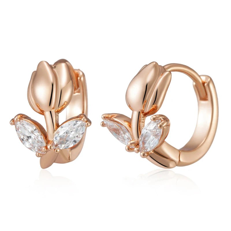 Pair of rose gold tulip huggie hoop earrings with clear marquise leaf stones, front and side view