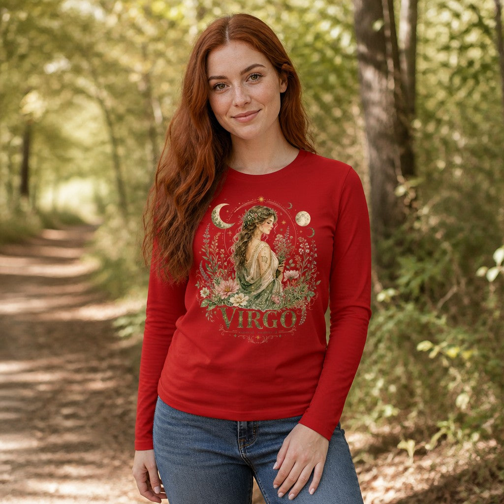 Woman in a red Bella Canvas 3501 long sleeve featuring a vintage watercolor Virgo maiden surrounded by wildflowers, crescent moons, and stars; cottagecore zodiac design for astrology lovers, standing on a wooded path, by Crossroads Dandelion
