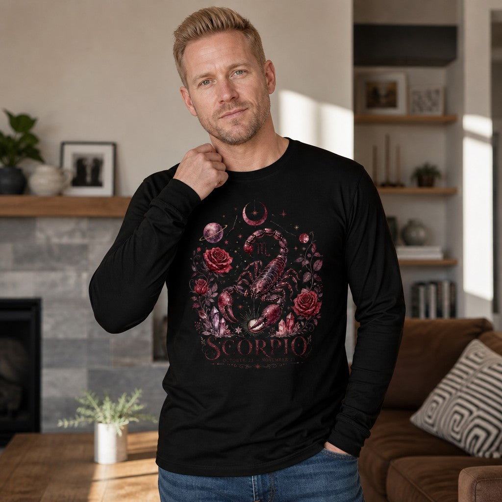 Man wearing black Bella Canvas 3501 long sleeve shirt with vintage cottagecore Scorpio scorpion, deep red roses, crystals, crescent moons, and celestial botanical design, standing in cozy living room, astrology fans, by Crossroads Dandelion