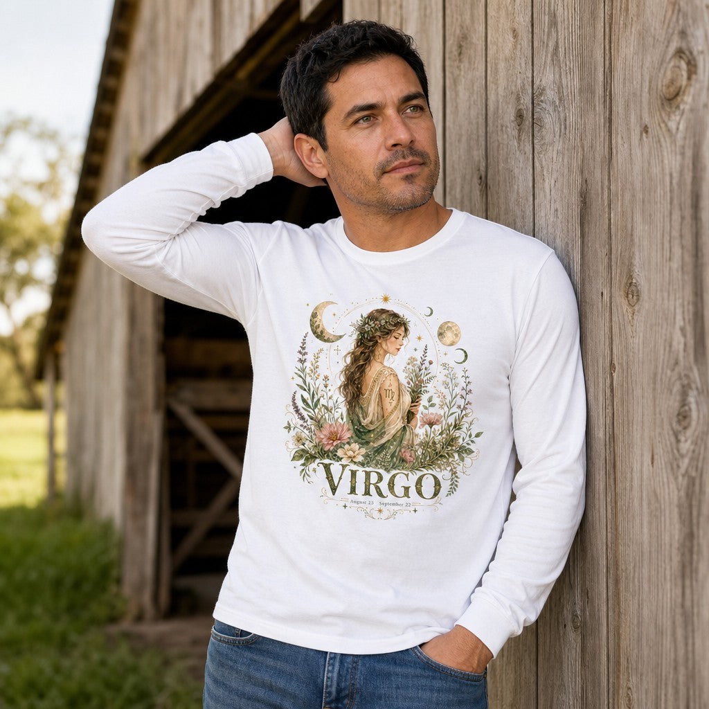 Man wearing white Bella Canvas 3501 long sleeve shirt featuring a vintage watercolor illustration of a Virgo maiden surrounded by wildflowers, crescent moons, and stars; cottagecore celestial botanical design for astrology fans, outdoor rustic barn setting, by Crossroads Dandelion