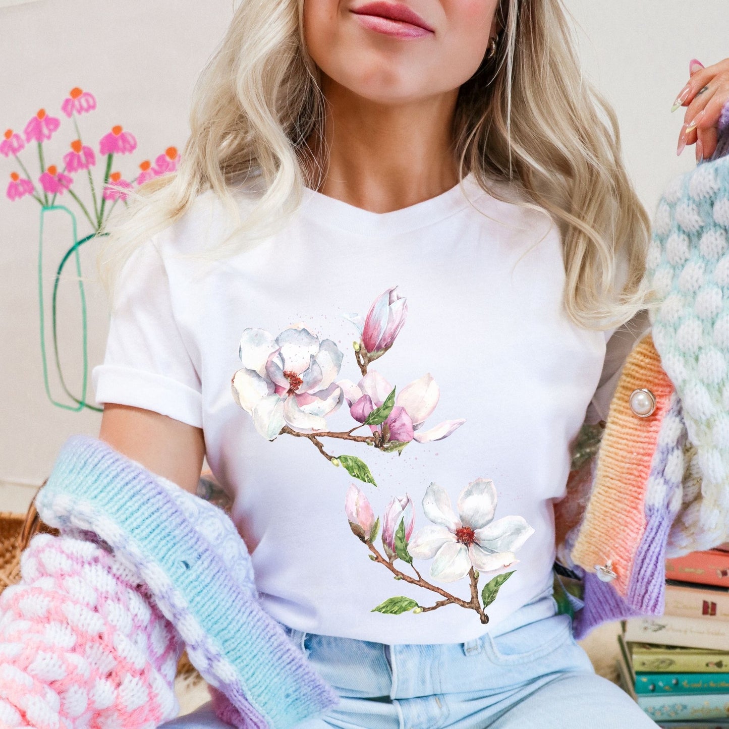 Woman wearing a white vintage magnolia botanical tee with watercolor floral design by Crossroads Dandelion