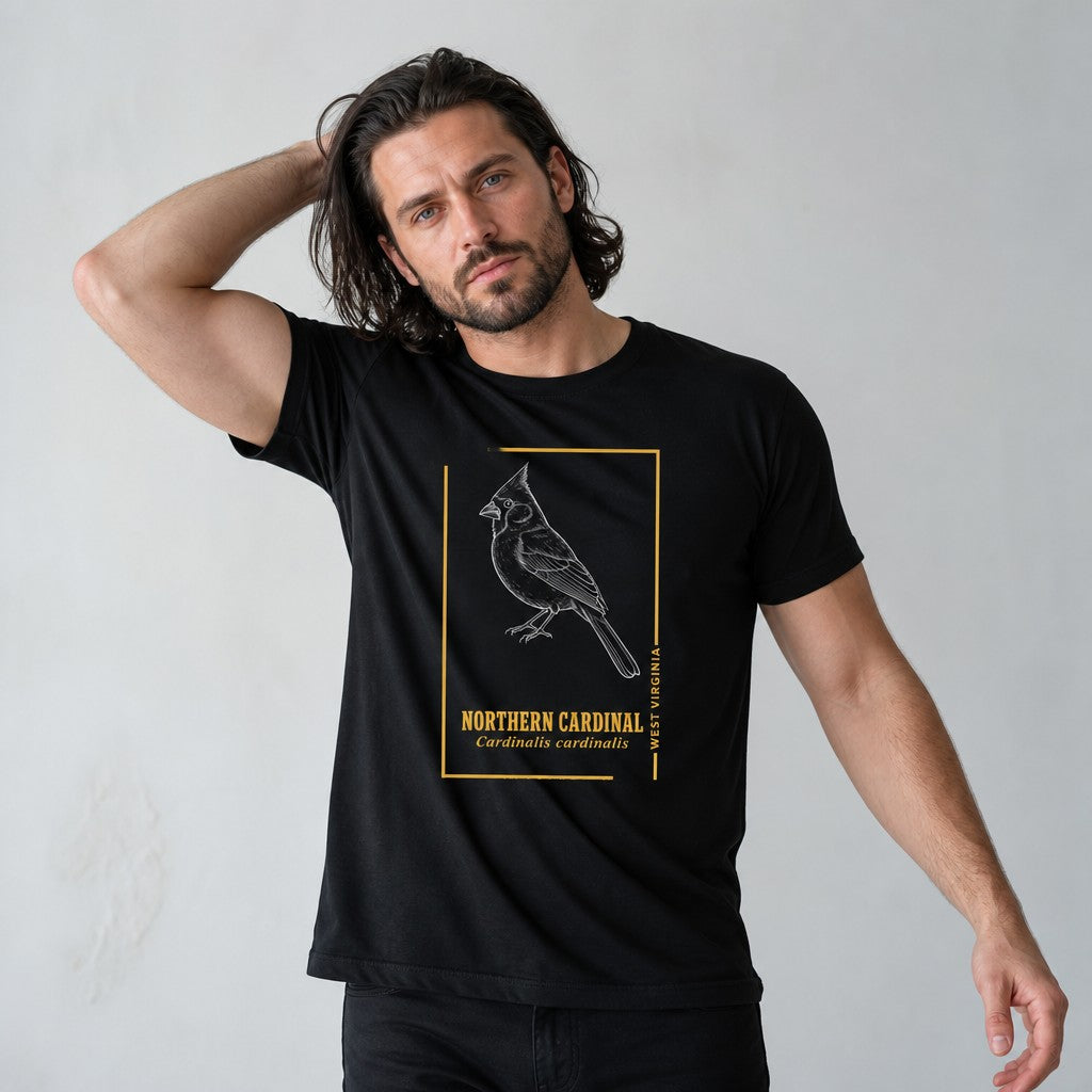 Man wearing black Bella Canvas 3001 t-shirt featuring a vintage hand-drawn Northern Cardinal illustration with golden border and Latin name, inspired by botanical field guides, for birdwatchers and nature lovers, by Crossroads Dandelion