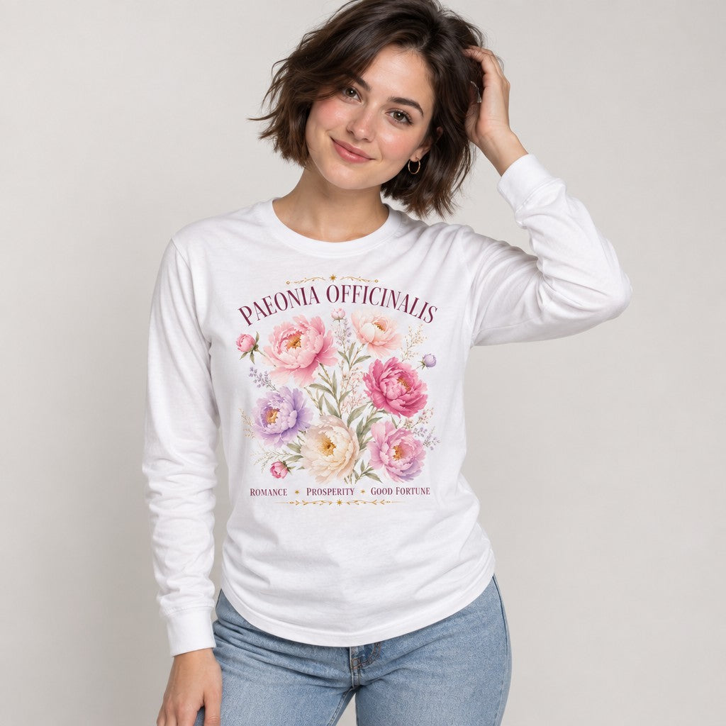 Woman in white Bella Canvas 3501 long sleeve shirt featuring a vintage botanical illustration of peony flowers with elegant typography reading 'PAEONIA OFFICINALIS' and symbolic words, cottagecore romantic floral design, classic garden lovers, by Crossroads Dandelion