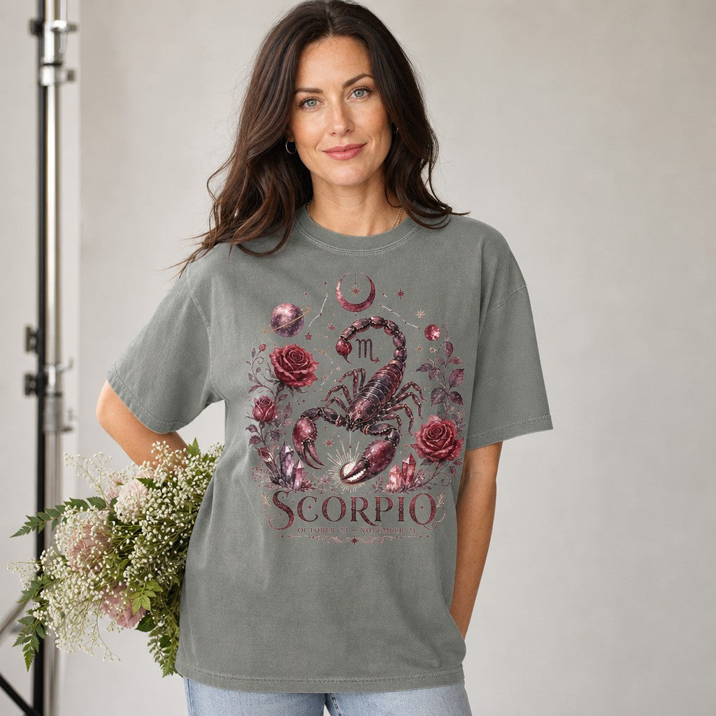 Woman wearing a grey Comfort Colors t-shirt with a vintage celestial Scorpio design featuring a detailed hand-drawn scorpion, dark red roses, stars, moon, and crystals, perfect for astrology lovers and mystical style fans, by Crossroads Dandelion