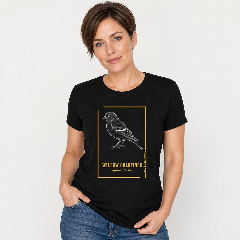 Woman in black Bella Canvas 3001 t-shirt featuring a vintage etching style willow goldfinch framed in golden accents and classic serif text, elegant botanical design for birdwatchers and nature lovers, by Crossroads Dandelion
