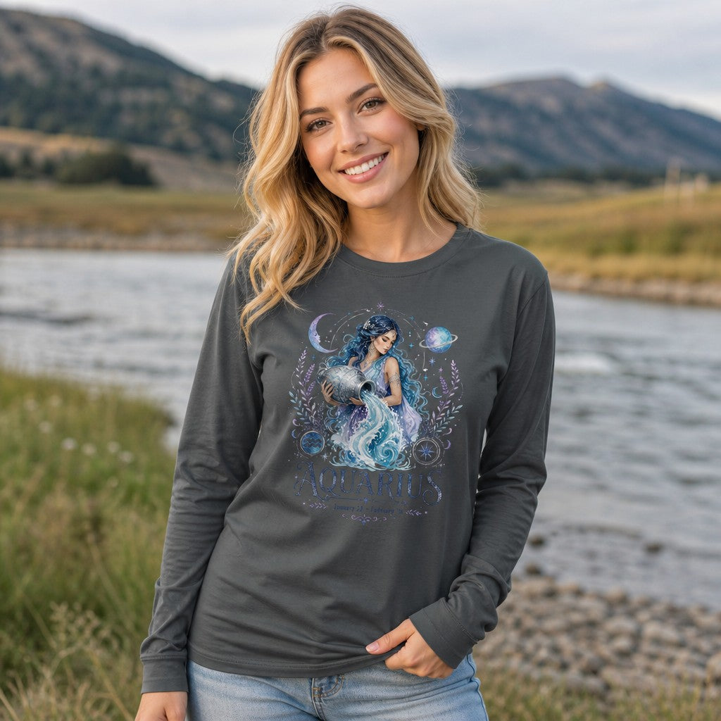 Woman standing by a riverside in an asphalt Bella Canvas 3501 long sleeve, featuring a watercolor Aquarius goddess with flowing blue hair, celestial planets, moons, and botanical flourishes, vintage zodiac design for astrology lovers, by Crossroads Dandelion