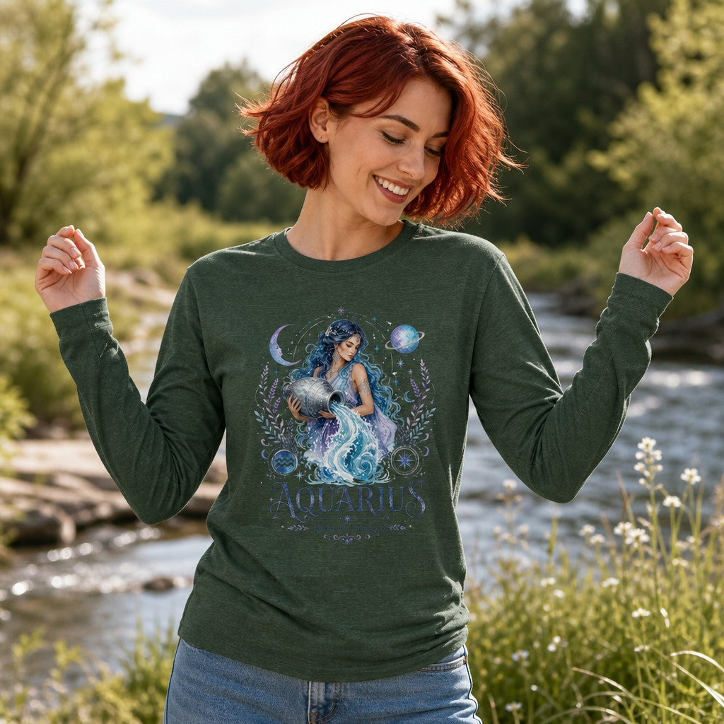 Woman outdoors by a riverside in a heather forest Bella Canvas long sleeve featuring an enchanting watercolor Aquarius goddess with flowing blue hair, celestial planets, moons, and botanical flourishes design, celestial vintage style, perfect for astrology lovers and zodiac enthusiasts, by Crossroads Dandelion