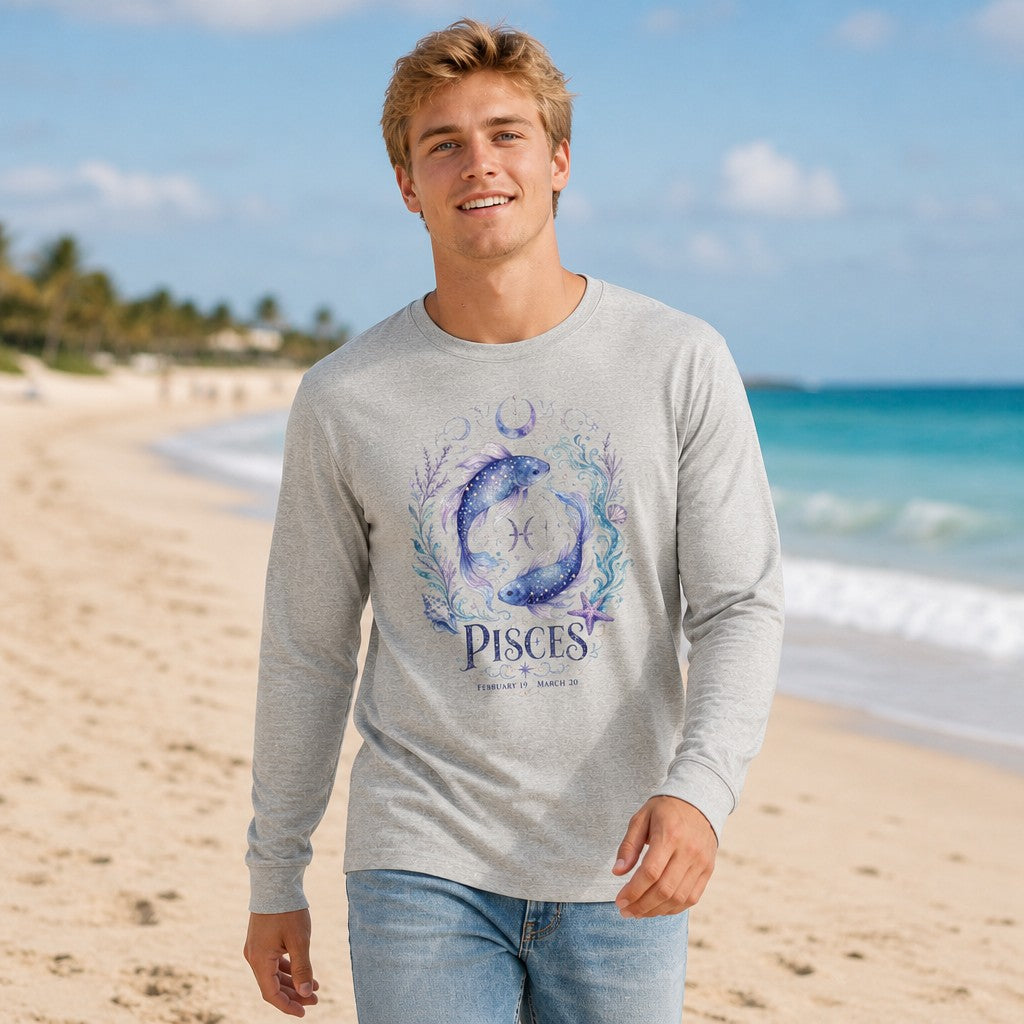 Man wearing athletic heather Bella Canvas 3501 long sleeve shirt with a watercolor Pisces koi fish and celestial floral design, walking on a sunny beach, astrology and zodiac themed apparel for gentle souls, by Crossroads Dandelion