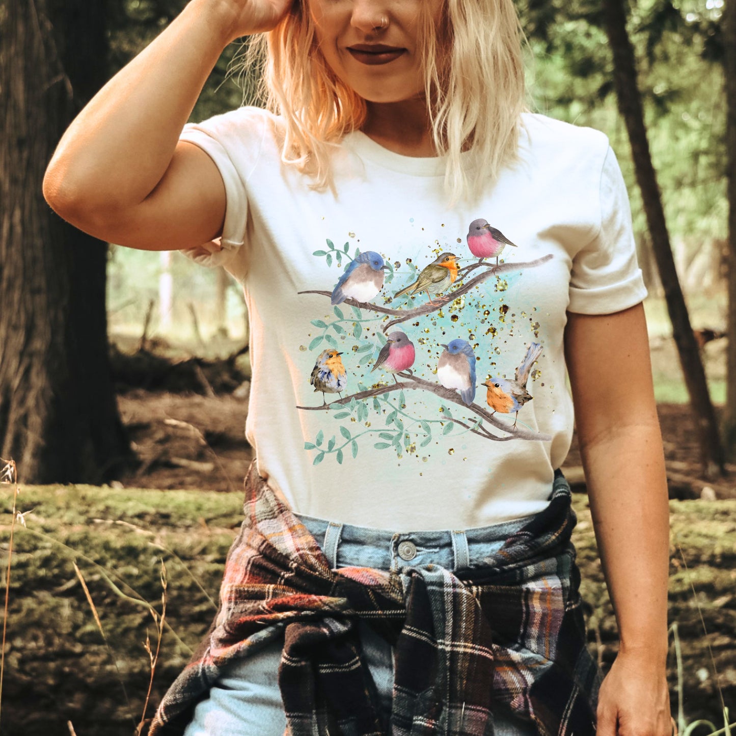Woman wearing white watercolor bird t-shirt with spring songbirds design by CrossroadsDandelion